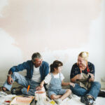 family painting in their home for renovations