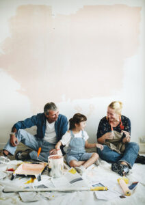 family painting in their home for renovations
