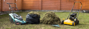 Gardener Operating Soil Aeration Machine on Grass Lawn.
